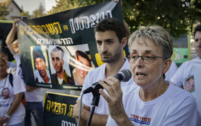 Parents, family members and friends of late IDF soldier Hadar Goldin attend a demonstration outside the state memorial ceremony for the 2014 Operation Protective Edge at Mount Herzl, calling for the return of the missing soldiers Goldin and Oron Shaul who were killed and taken by Hamas during the operation 7 years earlier, seen on June 20, 2021. (Olivier Fitoussi/Flash90)
