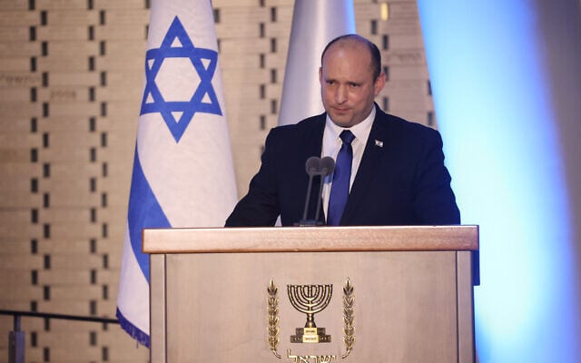 Prime Minister Naftali Bennett at a state memorial ceremony marking even years since Operation Protective Edge at the National Memorial Hall at the entrance to the military cemetery on Mount Herzl, June 20, 2021. (Yonatan Sindel/Flash90) Prime Minister Naftali Bennett at a state memorial ceremony marking even years since Operation Protective Edge at the National Memorial Hall at the entrance to the military cemetery on Mount Herzl, June 20, 2021. (Yonatan Sindel/Flash90)