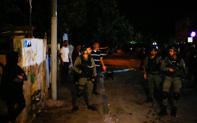 Illustrative: Border Police officers guard near a Jewish home in the East Jerusalem neighborhood of Sheikh Jarrah on June 22, 2021. (Jamal Awad/Flash90) Illustrative: Border Police officers guard near a Jewish home in the East Jerusalem neighborhood of Sheikh Jarrah on June 22, 2021. (Jamal Awad/Flash90)