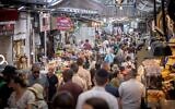 Israelis shop at the Mahane Yehuda market in Jerusalem on June 24, 2021. (Yonatan Sindel/Flash90)