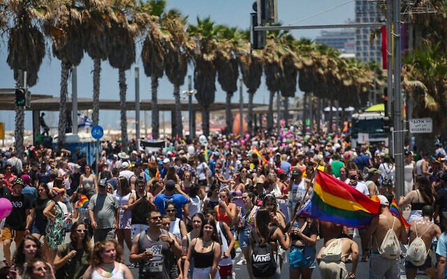 People participate at the annual Gay Pride Parade in Tel Aviv, on June 25, 2021. (Miriam Alster/Flash90) People participate at the annual Gay Pride Parade in Tel Aviv, on June 25, 2021. (Miriam Alster/Flash90)