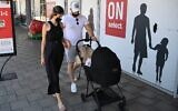 People at a shopping center in the northern city of Kiryat Shmona, on June 25, 2021. (Michael Giladi/Flash90)