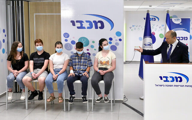 Prime Minister Prime Minister Naftali Bennett at a youth vaccination center in Holon on June 29, 2021. (Marc Israel Sellem/POOL/Flash90) Prime Minister Prime Minister Naftali Bennett at a youth vaccination center in Holon on June 29, 2021. (Marc Israel Sellem/POOL/Flash90)
