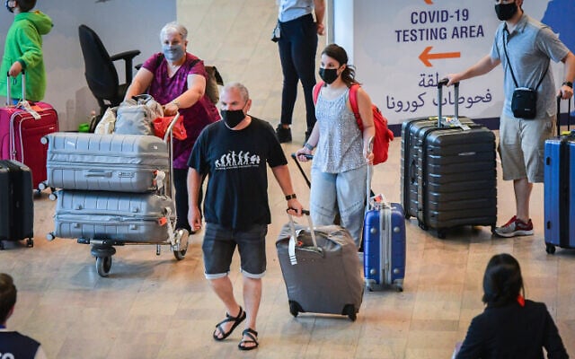 Travelers at Ben Gurion International Airport, on June 30, 2021, heading for COVID-19 tests. (Avshalom Sassoni/Flash90) Travelers at Ben Gurion International Airport, on June 30, 2021, heading for COVID-19 tests. (Avshalom Sassoni/Flash90)