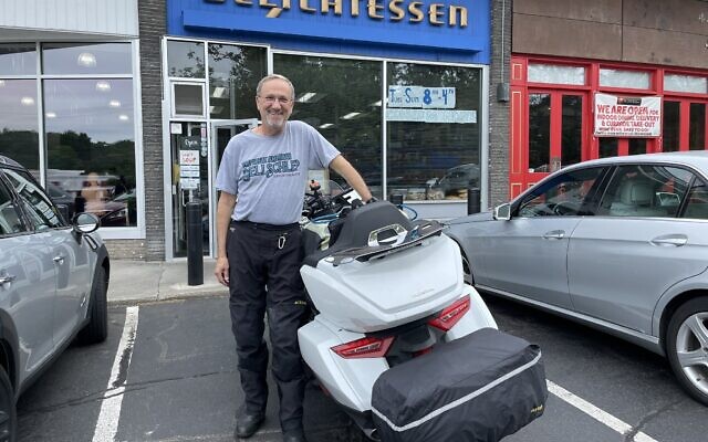 Jewish biker Steve Goode outside Gold's Deli in Westport, Connecticut, part of his 75-day cross-country trek that will see him visit 42 delis to help spread awareness about the problem of food insecurity. (Cathryn J. Prince)
