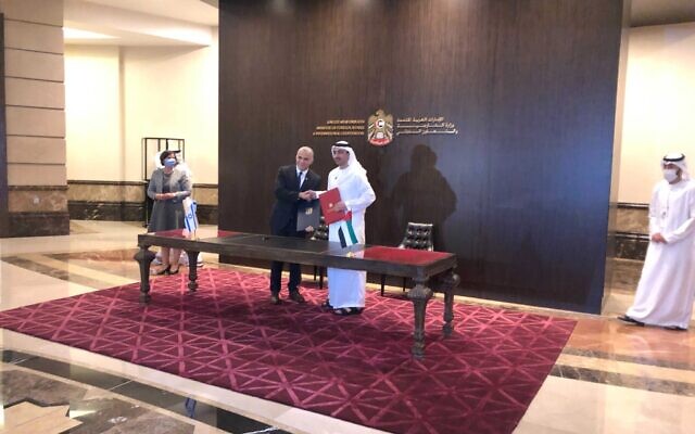 Foreign Minister Yair Lapid (L) and his Emirati counterpart Abdullah bin Zayed Al Nahyan sign an economic and trade agreement at the UAE Foreign Ministry in Abu Dhabi, on June 29, 2021. (Lazar Berman/Times of Israel) Foreign Minister Yair Lapid (L) and his Emirati counterpart Abdullah bin Zayed Al Nahyan sign an economic and trade agreement at the UAE Foreign Ministry in Abu Dhabi, on June 29, 2021. (Lazar Berman/Times of Israel)