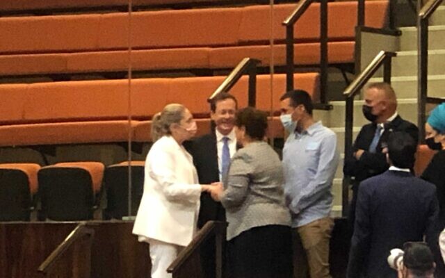 Presidential candidates Isaac Herzog and Miriam Peretz embrace before the vote, June 2, 2021. (Tal Schneider/Times of Israel) Presidential candidates Isaac Herzog and Miriam Peretz embrace before the vote, June 2, 2021. (Tal Schneider/Times of Israel)