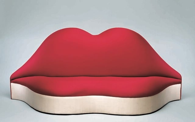 Spanish surrealist painter Salvador Dali's 'Mae West Lips Sofa' will be on display as part of a traveling Salvador Dali exhibit at the Herzliya Arena from July 9, 2021 (Courtesy Fundacio Gala)