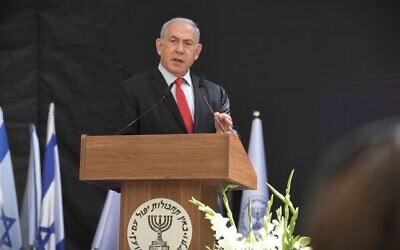 Prime Minister Benjamin Netanyahu addressing a ceremony to hand over control of the Mossad intelligence agency from outgoing director Yossi Cohen to his replacement David Barnea, June 1, 2021. (Koby Gideon/GPO)