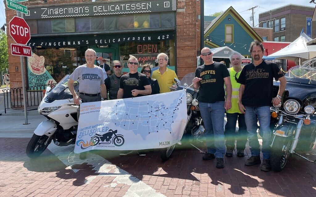 Steve Goode, far left, is biking across America to raise awareness about hunger by visiting Jewish delis. (Courtesy Goode/ via JTA) Steve Goode, far left, is biking across America to raise awareness about hunger by visiting Jewish delis. (Courtesy Goode/ via JTA)