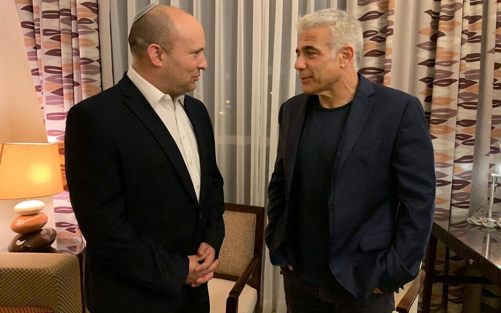 Yamina chief Naftali Bennett and Yesh Atid leader Yair Lapid are seen on Wednesday evening, as they inform President Reuven Rivlin they have succeeded in forming a government, June 2, 2021. (Courtesy) Yamina chief Naftali Bennett and Yesh Atid leader Yair Lapid are seen on Wednesday evening, as they inform President Reuven Rivlin they have succeeded in forming a government, June 2, 2021. (Courtesy)