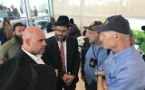 (L-R) Israeli Consul General in Miami Maor Elbaz-Starinsky, Tallahassee Chabad Rabbi Schneur Oirechman and Florida Senator Rick Scott at the scene of a condo building collapse in Surfside, Florida on June 25, 2021. (Consulate of Israel in Miami)