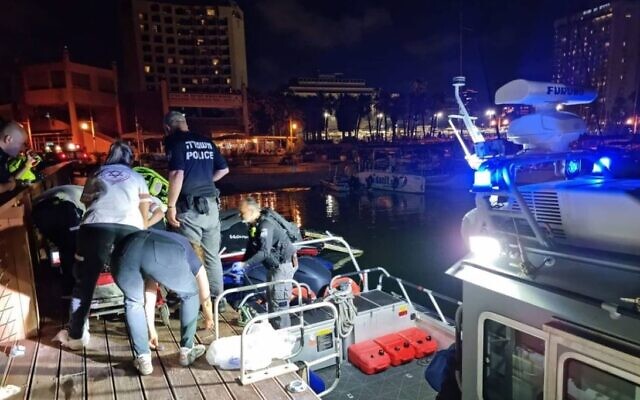 Rescuers pulling a boy who drowned from the sea near Tel Aviv on June 18, 2021. (Magen David Adom)