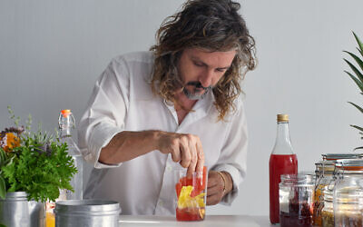 Gazoz master Benny Briga mixes one of his special sparkling water fruit drinks, as featured in 'Gazoz,' by Benny Briga and Adeena Sussman (Artisan Books). Copyright © 2021 (Photographs by Dan Perez)