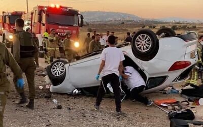 Rescue services work at the scene of a deadly car crash in the West Bank, on June 19, 2021. (Magen David Adom)