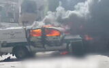 Two police cars are set on fire in the town of Deir al-Asad in northern Israel amid a clash between residents and officers, on June 19, 2021 (Screenshot/Twitter)