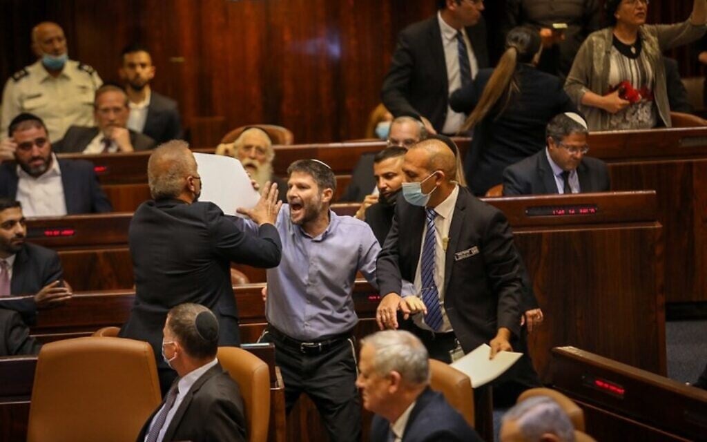 Religious Zionism head Bezalel Smotrich heckles Prime Minister-designate Naftali Bennettat the plenum, June 13, 2021 (Noam Moskowitz/Knesset)