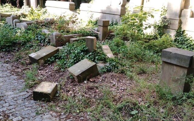 Toppled and smashed headstones lie scattered at the Jewish Cemetery of Wroclaw, Poland, June 16, 2021. (The Jewish Community of Wroclaw via JTA) Toppled and smashed headstones lie scattered at the Jewish Cemetery of Wroclaw, Poland, June 16, 2021. (The Jewish Community of Wroclaw via JTA)