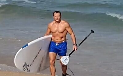 Tourism Minister Yoel Razvozov at the beach, June 19, 2021 (video screen grab)