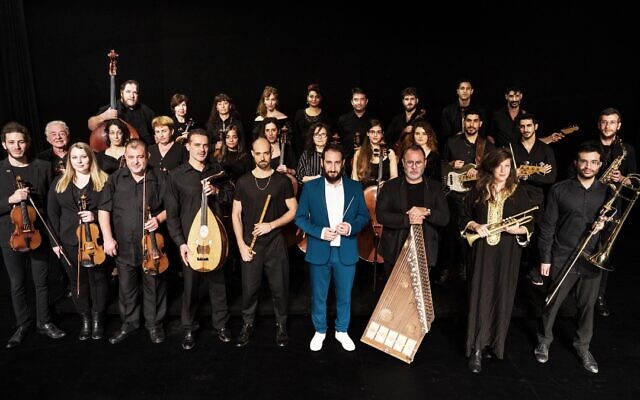 The Jerusalem Orchestra East West will perform 'Waiting for Nissim' with conductor Tom Cohen, and the book's authors, Shira Gefen and Etgar Keret, at the Israel Festival on June 17, 2021 (Courtesy Hayim Yafim Barblet) The Jerusalem Orchestra East West will perform 'Waiting for Nissim' with conductor Tom Cohen, and the book's authors, Shira Gefen and Etgar Keret, at the Israel Festival on June 17, 2021 (Courtesy Hayim Yafim Barblet)