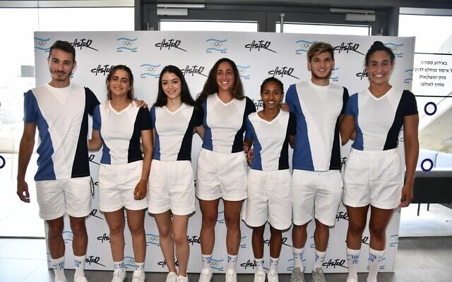 Seven Israeli athletes at the upcoming Tokyo Olympic games model the T-shirts and shorts that are part of their official uniforms. (Amit Schussel/IOC) Seven Israeli athletes at the upcoming Tokyo Olympic games model the T-shirts and shorts that are part of their official uniforms. (Amit Schussel/IOC)