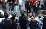 Palestinian police prevent demonstrators from gathering in the West Bank city of Ramallah ahead of a planned protest against the Palestinian Authority on July 5, 2021 (Photo by ABBAS MOMANI / AFP)