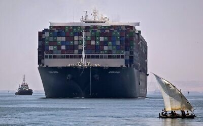 The Panama-flagged MV 'Ever Given' container ship sails near a felucca along Egypt's Suez Canal near the canal's central city of Ismailia, July 7, 2021. (Mahmoud KHALED / AFP)