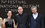 (From L) Israeli actress Nur Fibak, Israeli director Nadav Lapid and Israeli actor Avshalom Pollak pose as they arrive for the screening of the film 'Ha'Berech' (Ahed's Knee) at the 74th edition of the Cannes Film Festival in Cannes, southern France, on July 7, 2021. (John MACDOUGALL / AFP)