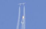 The Virgin Galactic SpaceShipTwo space plane Unity and mothership separate as they fly way above Spaceport America, near Truth and Consequences, New Mexico on July 11, 2021 on the way to the cosmos. (Patrick T. FALLON / AFP)