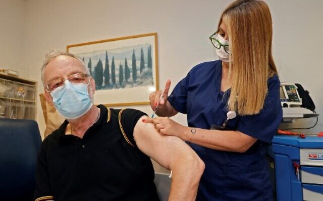 A man receives a third dose of the Pfizer-BioNTech COVID-19 coronavirus vaccine at the outpatient clinics of the Cardiovascular Centre at Sheba Medical Center near Tel Aviv, Israel, on July 12, 2021. (Jack Guez/AFP) A man receives a third dose of the Pfizer-BioNTech COVID-19 coronavirus vaccine at the outpatient clinics of the Cardiovascular Centre at Sheba Medical Center near Tel Aviv, Israel, on July 12, 2021. (Jack Guez/AFP)