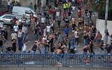 Supporters of Lebanon's prime minister-designate Saad Hariri, who stepped down saying he was unable to form a government, hurl stones at a Lebanese armored personnel carrier (unseen) in the capital Beirut on July 15, 2021. (AFP)