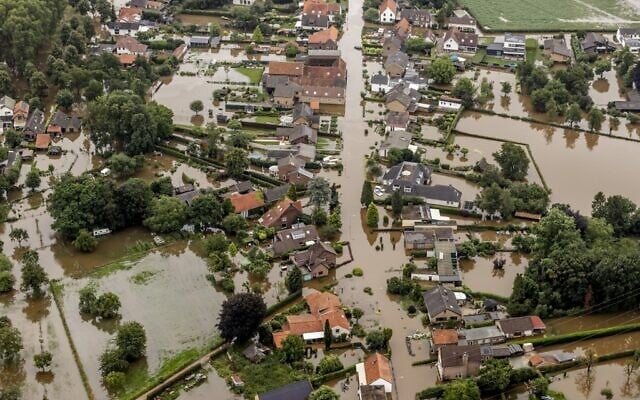 This aerial view taken in Brommelen on July 16, 2021 shows the flooded area around the Meuse after a levee of the Juliana Canal broke  (Remko de Waal / ANP / AFP)