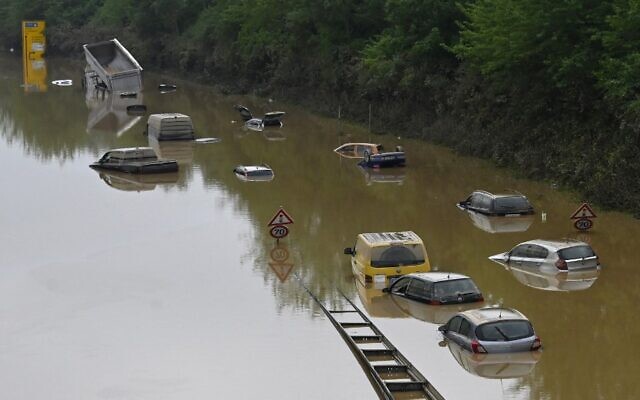 Submerged cars and other vehicles are seen on the federal highway B265 in Erftstadt, western Germany, on July 17, 2021 after heavy rains hit parts of the country, causing widespread flooding and major damage. (Photo by SEBASTIEN BOZON / AFP) Submerged cars and other vehicles are seen on the federal highway B265 in Erftstadt, western Germany, on July 17, 2021 after heavy rains hit parts of the country, causing widespread flooding and major damage. (Photo by SEBASTIEN BOZON / AFP)