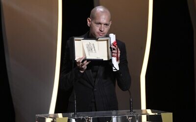 Israeli director Nadav Lapid give a speech after he was awarded with the Jury Prize for the film "Ha'Berech" during the closing ceremony of the Cannes Film Festival in Cannes, France, on July 17, 2021. (Christophe Simon/AFP)