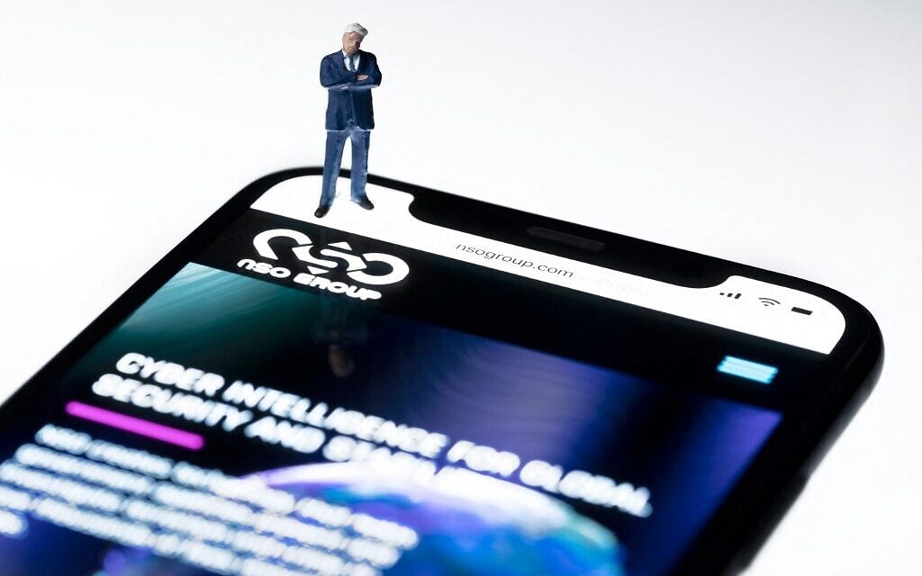 This studio photographic illustration shows a smartphone with the website of Israel's NSO Group which features 'Pegasus' spyware, on display in Paris, on July 21, 2021. (Joel Saget/AFP) This studio photographic illustration shows a smartphone with the website of Israel's NSO Group which features 'Pegasus' spyware, on display in Paris, on July 21, 2021. (Joel Saget/AFP)
