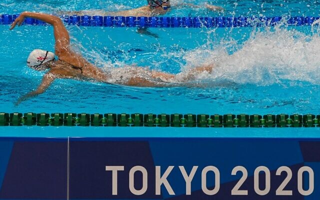 Athletes take part in a swimming training session at the Tokyo Aquatics Centre in Tokyo on July 23, 2021, ahead of the Tokyo 2020 Olympic Games. (Attila KISBENEDEK / AFP)