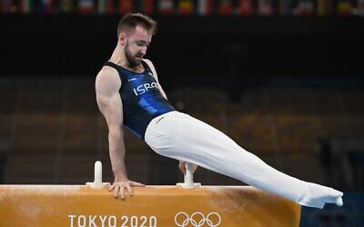 Israel's Artem Dolgopyat competes in the pommel horse event of the artistic gymnastics men's qualification during the Tokyo 2020 Olympic Games at the Ariake Gymnastics Centre in Tokyo on July 24, 2021. (Lionel BONAVENTURE / AFP)