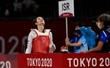Israel's Abishag Semberg celebrates wining the taekwondo women's -49kg bronze medal A bout during the Tokyo 2020 Olympic Games at the Makuhari Messe Hall in Tokyo, on July 24, 2021. (Javier Soriano/AFP)