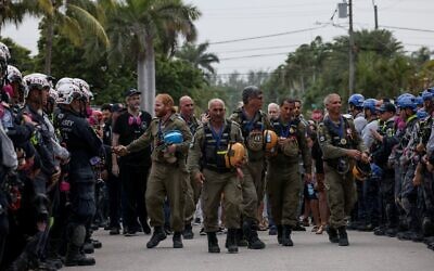 Members of the Israel Defense Forces National Rescue Unit are given a send off by search and rescue personnel July 10, 2021 in Surfside, Florida (Anna Moneymaker/Getty Images/AFP)