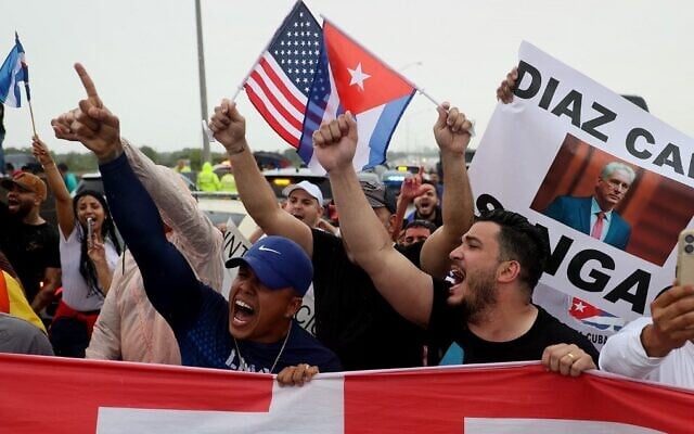 Protesters shut down part of the Palmetto Expressway as they show their support for anti-government protesters in Cuba, on July 13, 2021, in Miami, Florida. (Joe Raedle/Getty Images/AFP) Protesters shut down part of the Palmetto Expressway as they show their support for anti-government protesters in Cuba, on July 13, 2021, in Miami, Florida. (Joe Raedle/Getty Images/AFP)