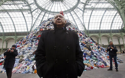 French artist Christian Boltanski stands next to his installation 'Persones' during the Monumenta 2010 exhibition at the Grand Palais in Paris, January 12, 2010.(AP Photo/Michel Euler)