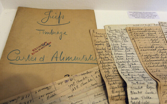 Illustrative: In this photo taken on July 16, 2012 documents coming from the Archives of Paris Police Prefecture and showing lists of Jewish people registered during WWII, are presented for an exhibition of French archives on Shoah in Paris. (AP/Remy de la Mauviniere) Illustrative: In this photo taken on July 16, 2012 documents coming from the Archives of Paris Police Prefecture and showing lists of Jewish people registered during WWII, are presented for an exhibition of French archives on Shoah in Paris. (AP/Remy de la Mauviniere)