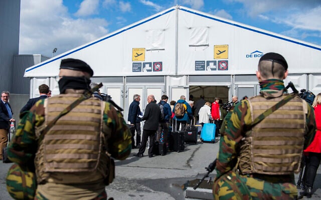 illustrative: Soldiers patrol as passengers arrive at a temporarily check in a terminal at Brussels Airport, in Zaventem, Belgium, Monday, April 4, 2016. (AP Photo/Laurie Dieffembach, Pool) illustrative: Soldiers patrol as passengers arrive at a temporarily check in a terminal at Brussels Airport, in Zaventem, Belgium, Monday, April 4, 2016. (AP Photo/Laurie Dieffembach, Pool)