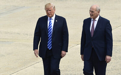 Then-US president Donald Trump and White House chief of staff John Kelly walk toward Air Force One at Andrews Air Force Base in Maryland, May 4, 2018. (AP Photo/Susan Walsh)