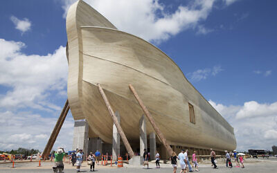 Visitors pass outside the front of a replica Noah's Ark at the Ark Encounter theme park during a media preview day, in Williamstown, Kentucky, July 5, 2016. (AP Photo/John Minchillo, File)