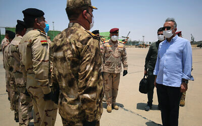Iraq's Prime Minister Mustafa al-Kadhimi, right, arrives in Basra, Iraq, July 15, 2020. (Ahmed al-Rubaye/Pool Photo via AP)