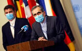 Iran's UN Ambassador Majid Takht Ravanchi speaks to reporters following a meeting with members of the UN Security Council, August 20, 2020, at the United Nations. (Mike Segar/Pool via AP)