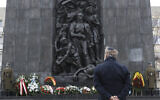 A wreath is laid at the monument to the Heroes of the Warsaw Ghetto in Warsaw, Poland, on Wednesday, on January 27, 2021, to recognize Holocaust victims. (AP Photo/Czarek Sokolowski)