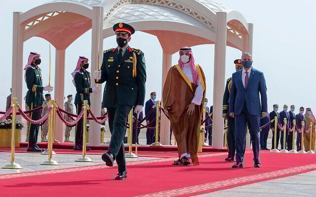 Saudi Crown Prince Mohammed bin Salman, center right, accompanies Iraqi Prime Minister Mustafa al-Kadhimi on his arrival at Riyadh International Airport, Saudi Arabia, March 31, 2021. Kadhimi visited Saudi Arabia shortly before a first round of direct talks held in April in Baghdad between regional rivals Saudi Arabia and Iran. (Bandar Aljaloud/Saudi Royal Palace via AP, File) Saudi Crown Prince Mohammed bin Salman, center right, accompanies Iraqi Prime Minister Mustafa al-Kadhimi on his arrival at Riyadh International Airport, Saudi Arabia, March 31, 2021. Kadhimi visited Saudi Arabia shortly before a first round of direct talks held in April in Baghdad between regional rivals Saudi Arabia and Iran. (Bandar Aljaloud/Saudi Royal Palace via AP, File)