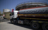 A fuel truck with a Qatari flag enters the Nusseirat power plant, in the central Gaza Strip, on June 28, 2021. (AP Photo/Khalil Hamra)